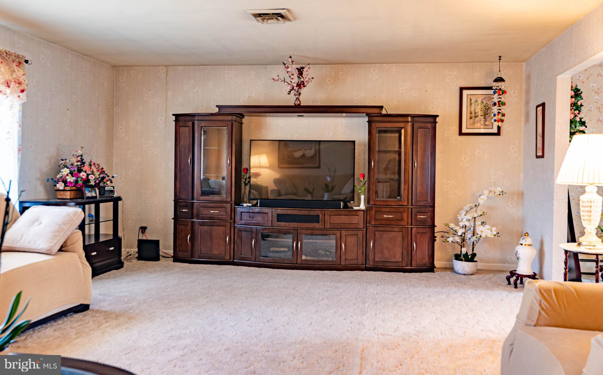 9619 Boyds Turn Road Owings, MD 20736 - Photo 15 of 69 a living room with furniture and a flat screen tv
