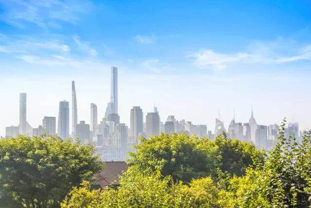 a view of a city with tall buildings in the background
