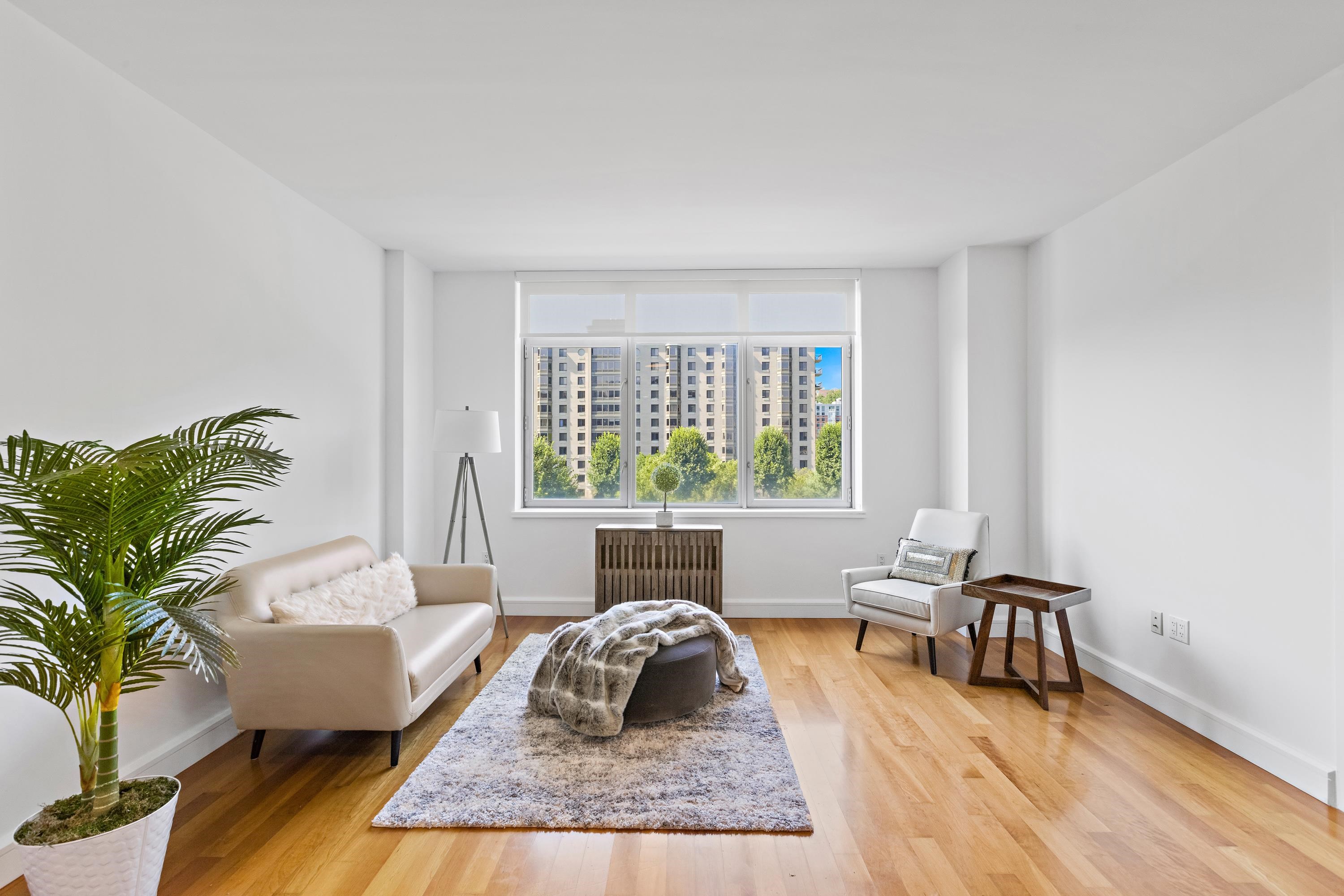 8100 River Road, Unit 510 North Bergen, NJ 07047 - Photo 12 of 25 a living room with furniture and a large window
