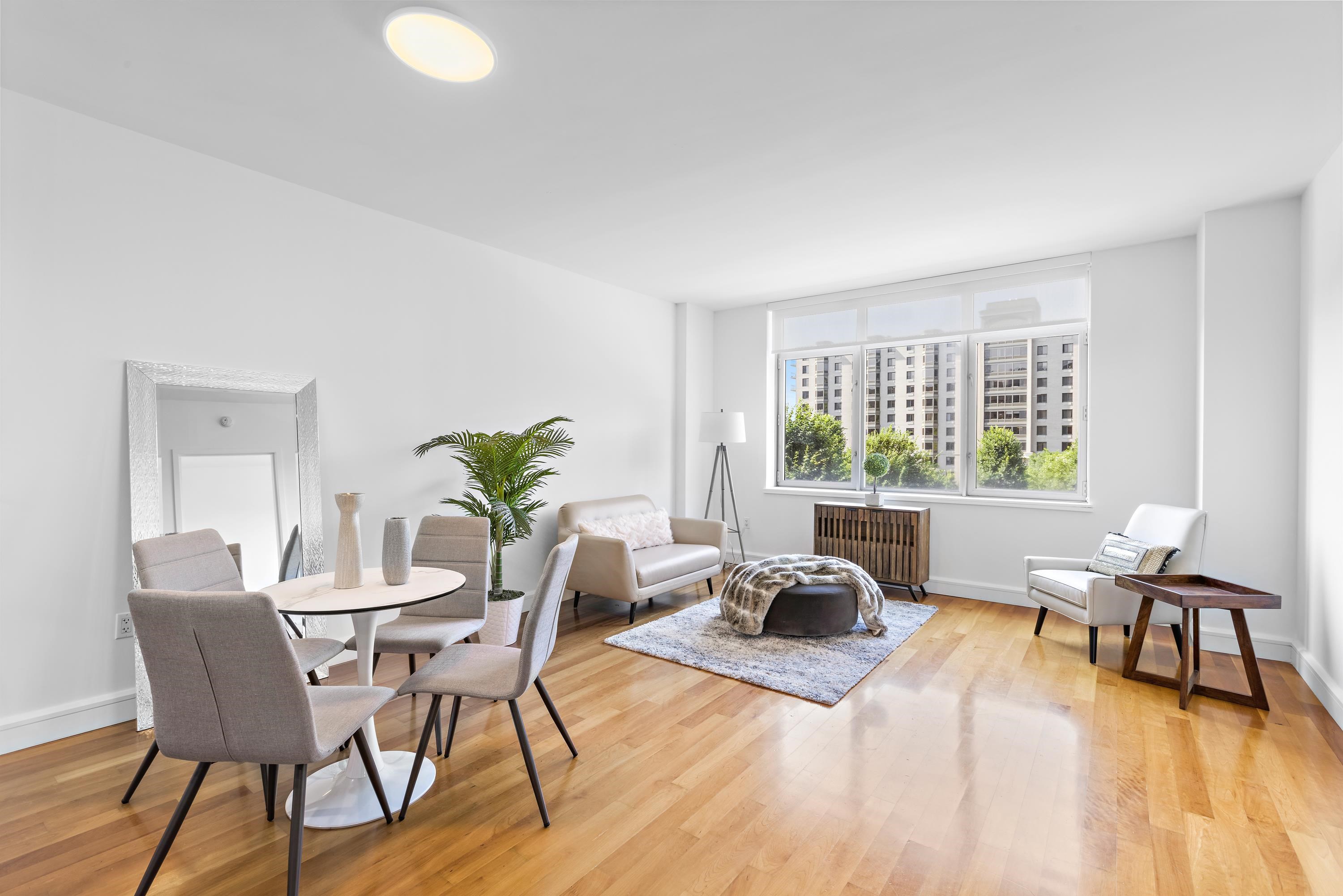 8100 River Road, Unit 510 North Bergen, NJ 07047 - Photo 13 of 25 a living room with furniture and a large window