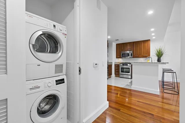 a view of a kitchen with washer and dryer