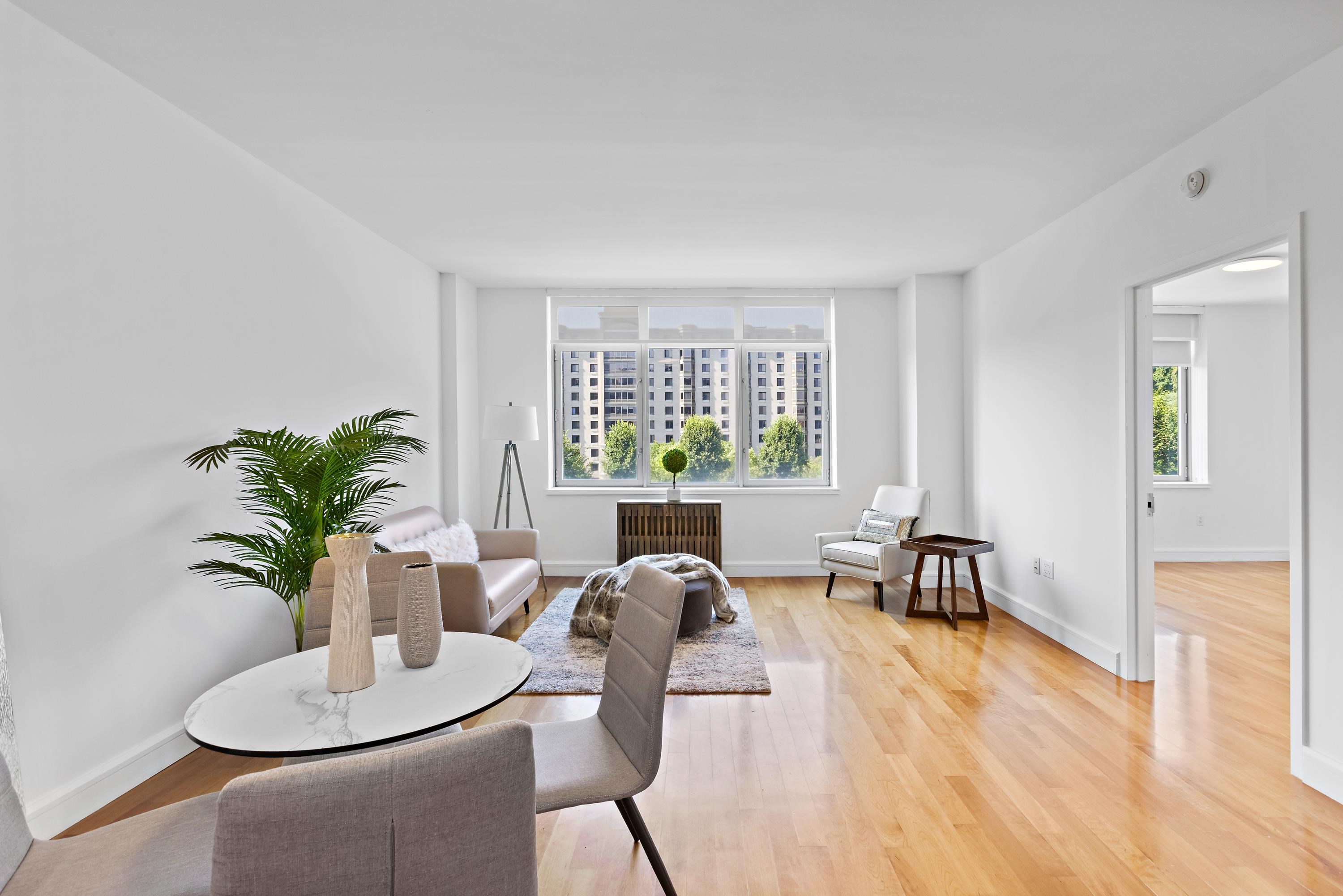 8100 River Road, Unit 510 North Bergen, NJ 07047 - Photo 4 of 25 a living room with furniture potted plant and a window