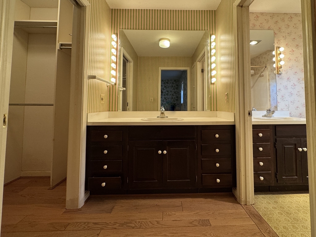 696 Bernardston Road Greenfield, MA 01301 - Photo 22 of 42 a bathroom with a granite countertop sink and a mirror