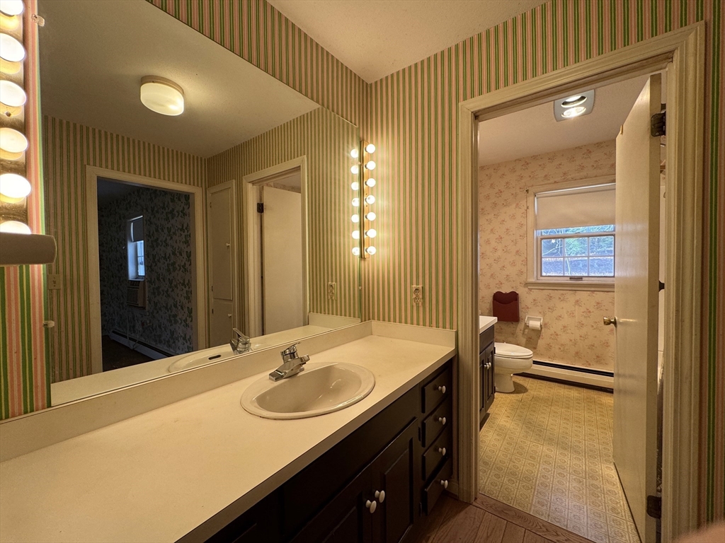 696 Bernardston Road Greenfield, MA 01301 - Photo 23 of 42 a bathroom with a sink and a mirror