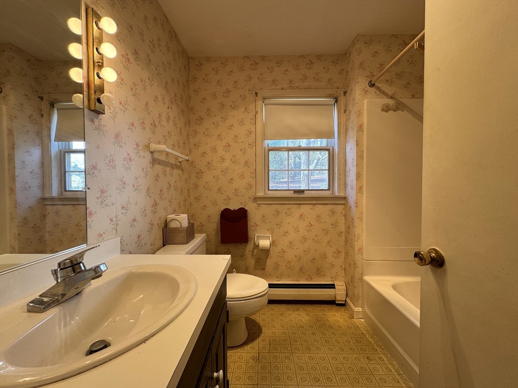 696 Bernardston Road Greenfield, MA 01301 - Photo 24 of 42 a bathroom with a sink a toilet and shower