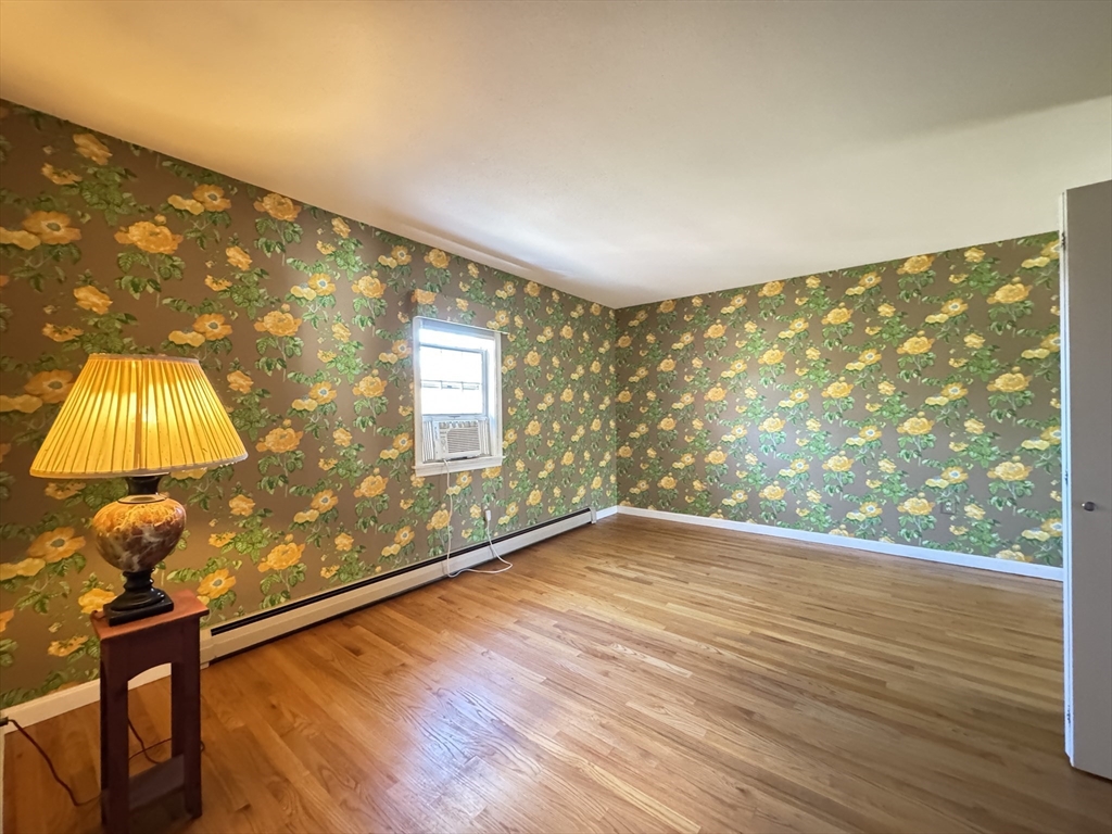 696 Bernardston Road Greenfield, MA 01301 - Photo 27 of 42 a view of empty room with wooden floor and fan