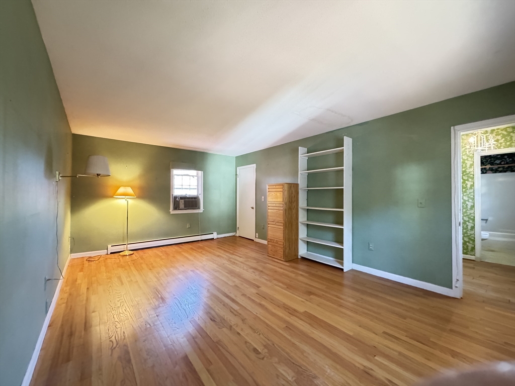 696 Bernardston Road Greenfield, MA 01301 - Photo 29 of 42 a view of empty room with wooden floor and fan