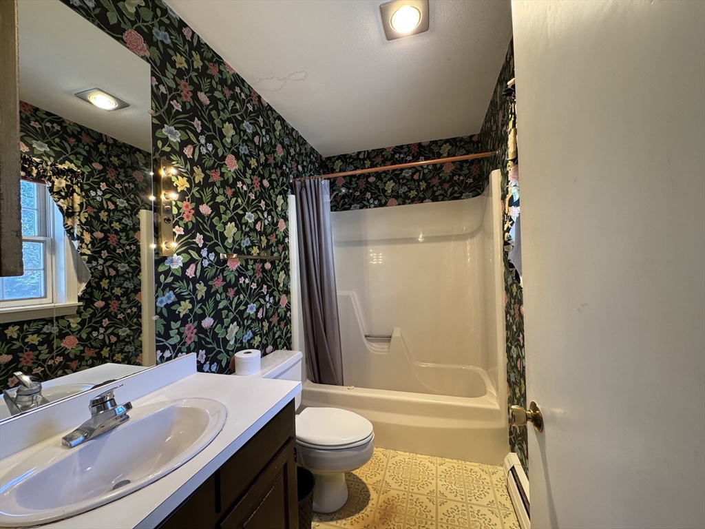 696 Bernardston Road Greenfield, MA 01301 - Photo 30 of 42 a bathroom with a sink toilet and shower