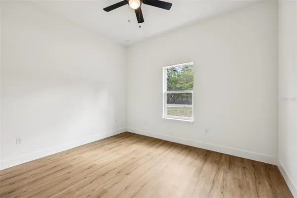 a spacious bathroom with a double vanity sink and mirror