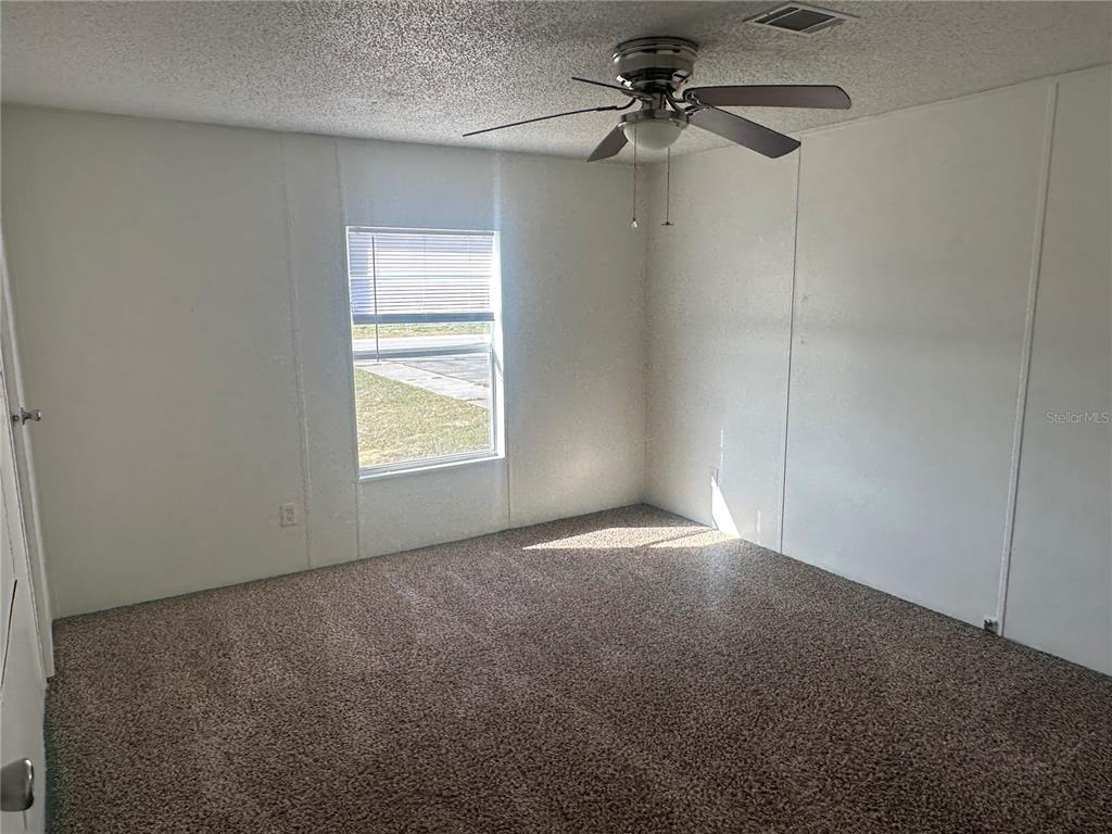 447 Tindel Camp Road Lake Wales, FL 33898 - Photo 8 of 15 a view of an empty room with a window
