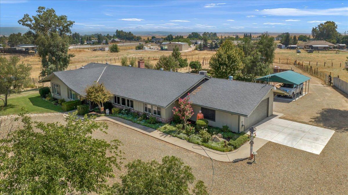 16397 Road 37 Madera, CA 93636 - Photo 11 of 74 an aerial view of a house with a garden and lake view