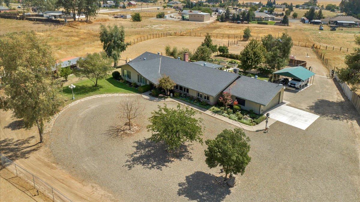 16397 Road 37 Madera, CA 93636 - Photo 12 of 74 an aerial view of a house with a yard and lake view