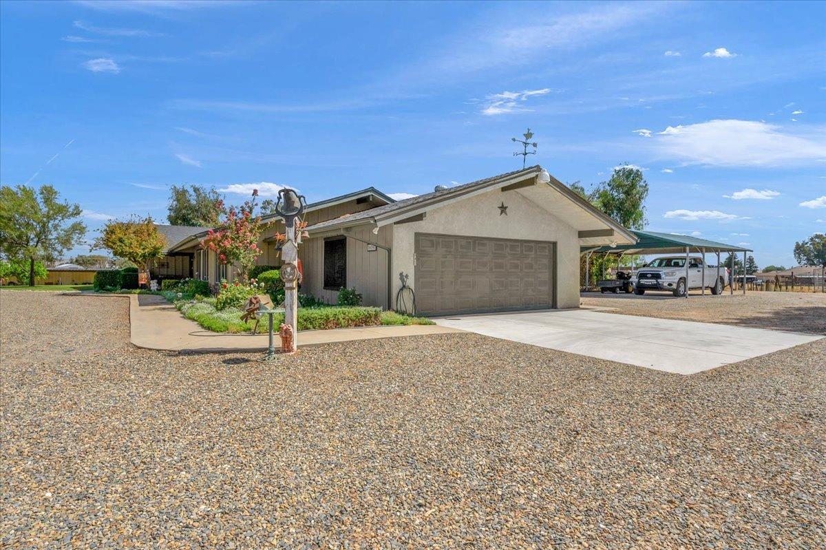 16397 Road 37 Madera, CA 93636 - Photo 16 of 74 Two car garage plus a carport as well.