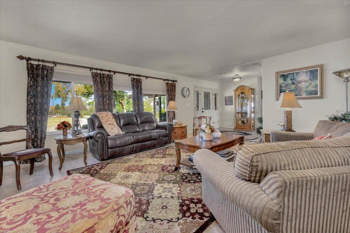 16397 Road 37 Madera, CA 93636 - Photo 20 of 74 a living room with furniture and a large window