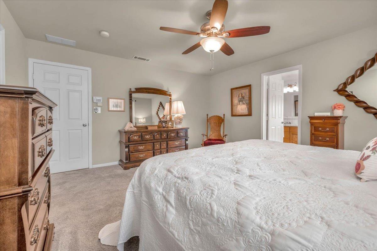 16397 Road 37 Madera, CA 93636 - Photo 29 of 74 This bedroom has its own bathroom with a jacuzzi tub and extra large shower. Take a look at the HUGE closet!! It comes with its own ironing board too!