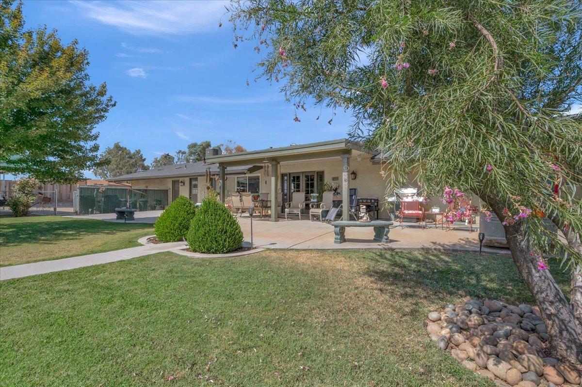 16397 Road 37 Madera, CA 93636 - Photo 36 of 74 a view of house with a garden