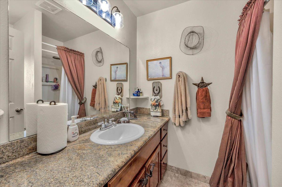 16397 Road 37 Madera, CA 93636 - Photo 39 of 74 a bathroom with a sink vanity granite and a mirror