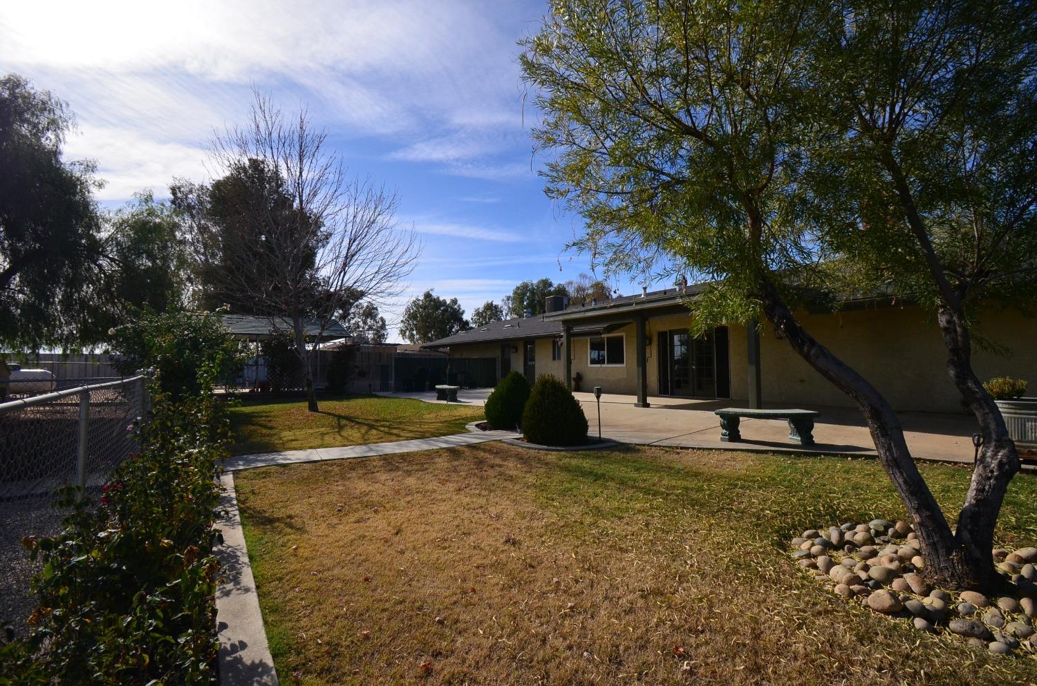 16397 Road 37 Madera, CA 93636 - Photo 73 of 74 a view of a house with backyard and trees