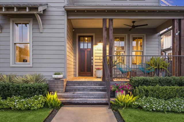 a front view of a house with a garden