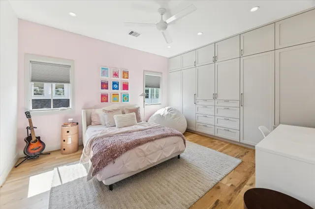 a spacious bedroom with a bed and a couch