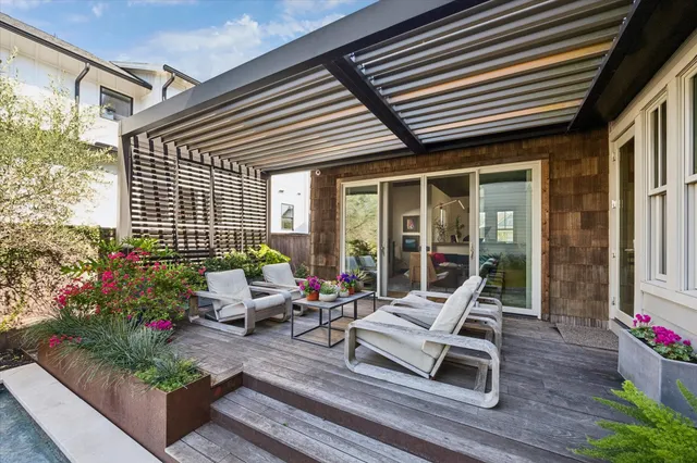 a building outdoor space with patio furniture and potted plants
