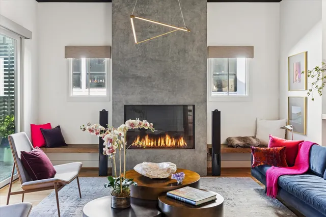 a living room with furniture and a fireplace