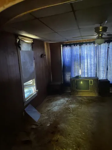 a view of an empty room with a fireplace