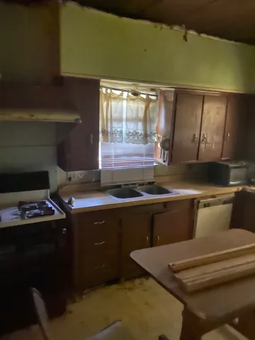 a kitchen with a stove and a sink