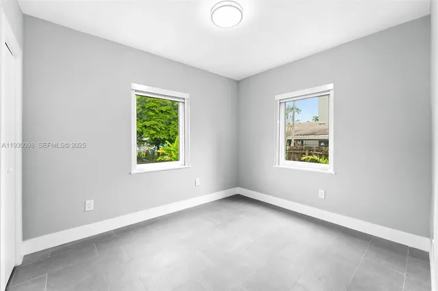 an empty room with windows