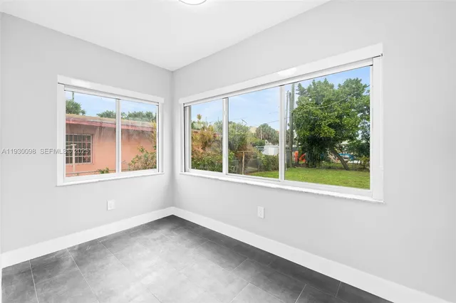 a view of a room with a large window