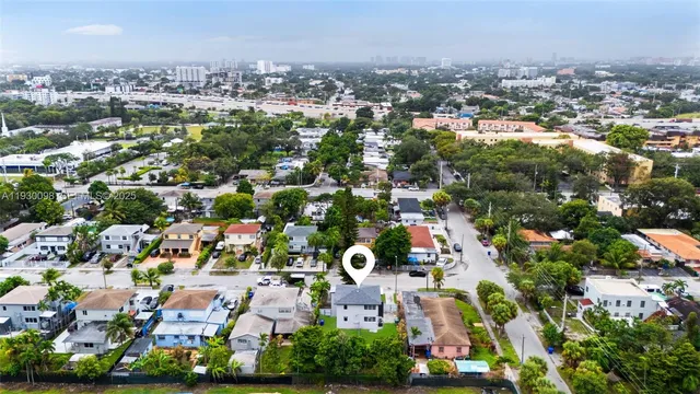 an aerial view of residential houses with outdoor space