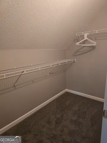 a view of a room with racks on the wall