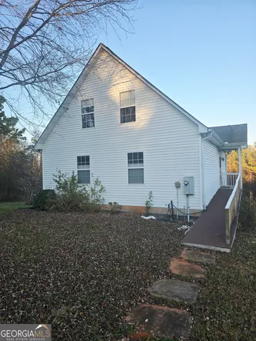 a backyard of a house with wooden fence
