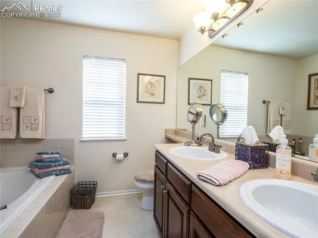 a bathroom with a tub and shower