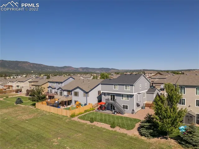 an aerial view of a house with a ocean view
