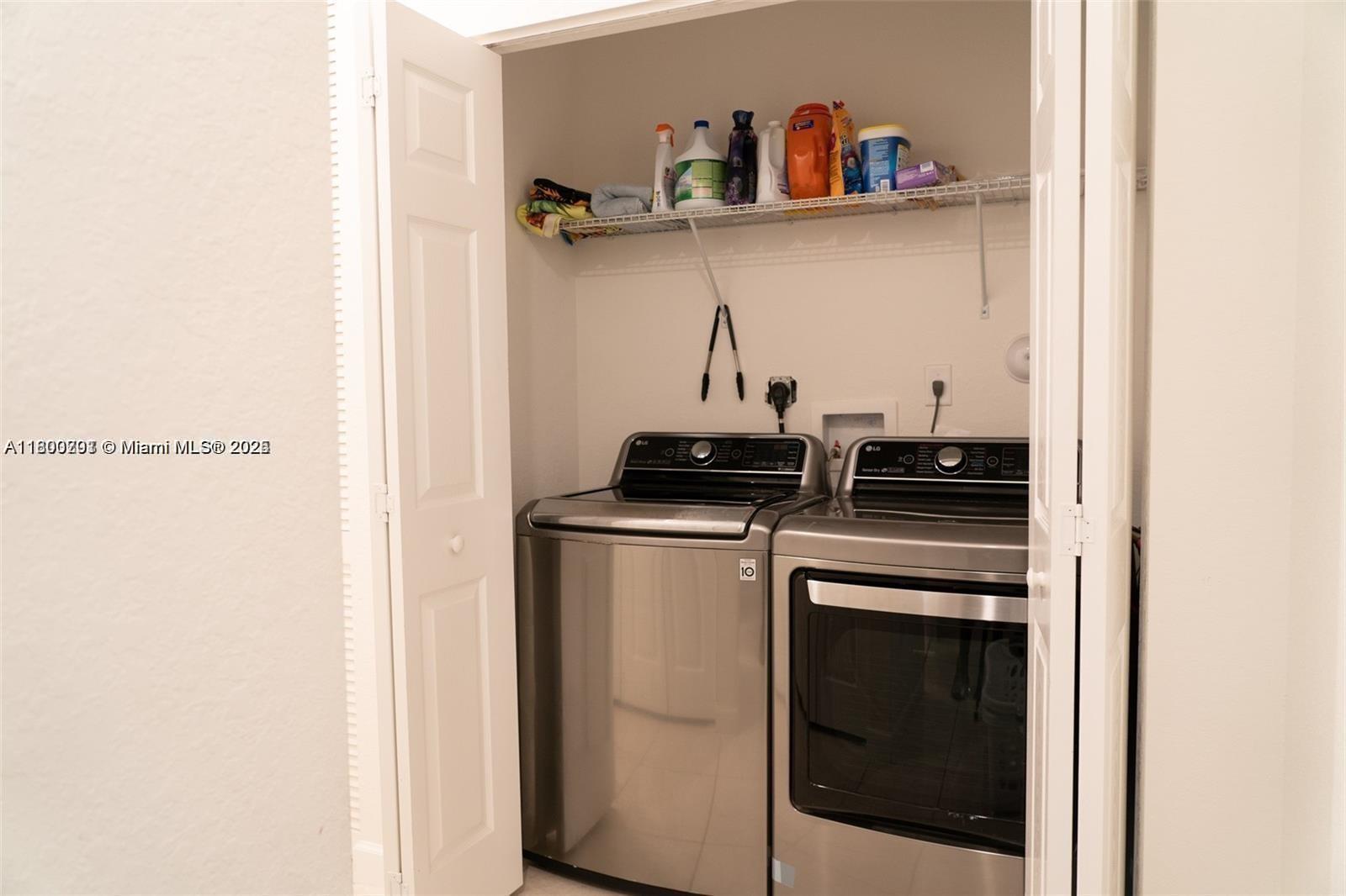 12833 Southwest 226th Street Miami, FL 33170 - Photo 11 of 13 a kitchen with a stove and cabinets