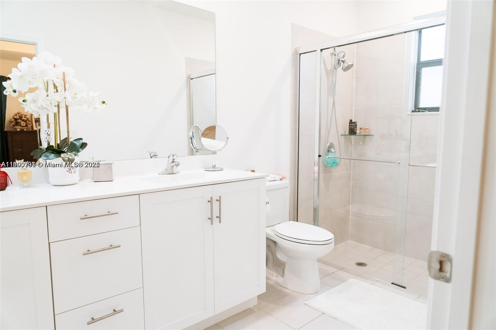 12833 Southwest 226th Street Miami, FL 33170 - Photo 10 of 13 a bathroom with a sink toilet and shower