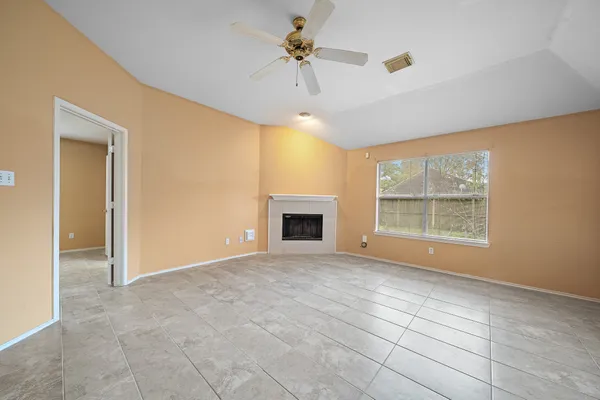 a view of an empty room with a window