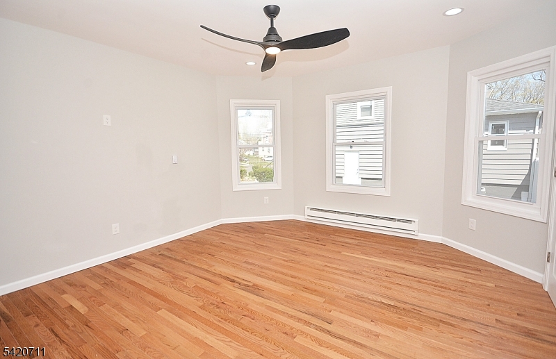 1324 George Street Plainfield, NJ 07062 - Photo 14 of 24 a view of an empty room with wooden floor and a window