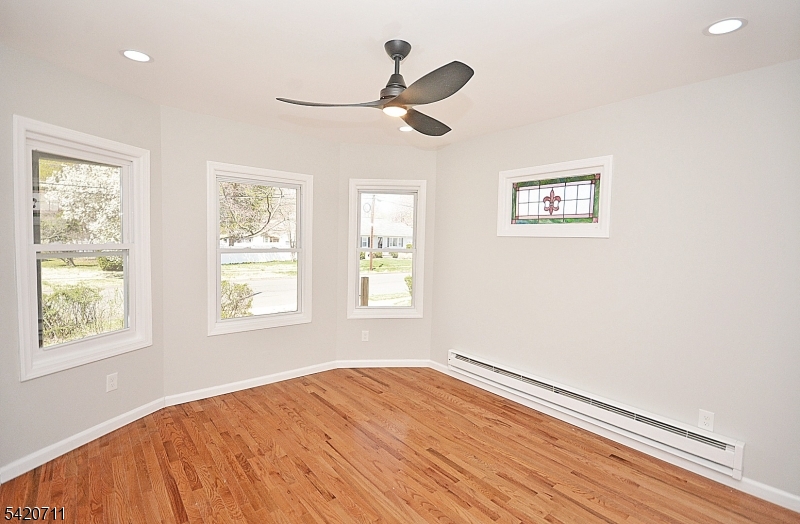 1324 George Street Plainfield, NJ 07062 - Photo 17 of 24 a view of empty room with wooden floor and window