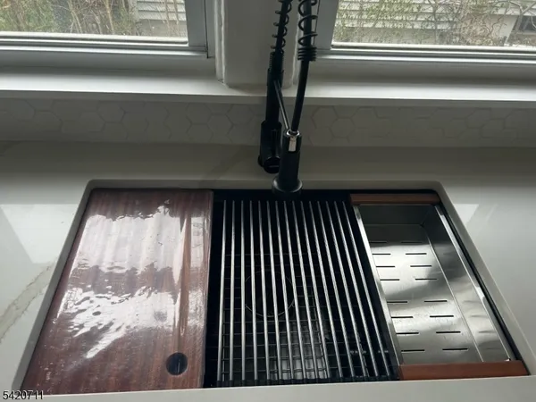 a kitchen with a table chairs stove and microwave