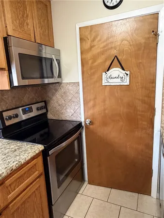 a kitchen with a stove and a microwave