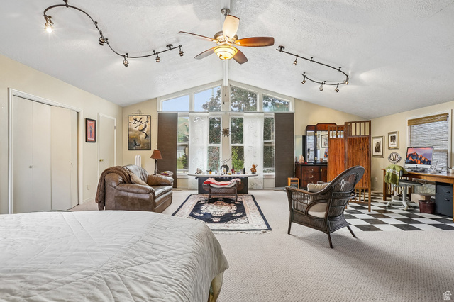 392 West 200 South Tooele, UT 84074 - Photo 4 of 29 Primary bedroom with vaulted ceilings, large windows for views and natural light