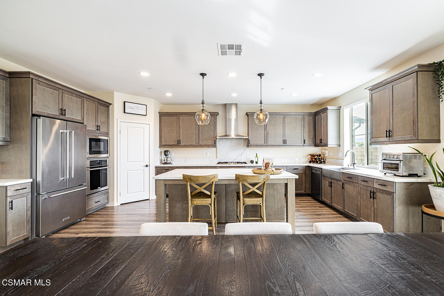 4616 Fannin Drive Simi Valley, CA 93063 - Photo 11 of 29 a large kitchen with stainless steel appliances and a refrigerator