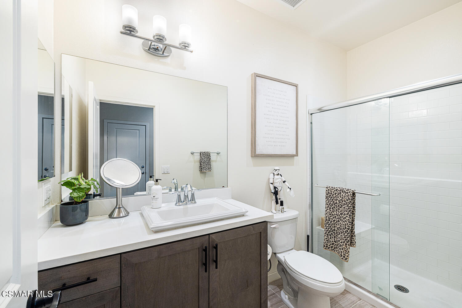 4616 Fannin Drive Simi Valley, CA 93063 - Photo 21 of 29 a bathroom with a toilet a sink and a mirror