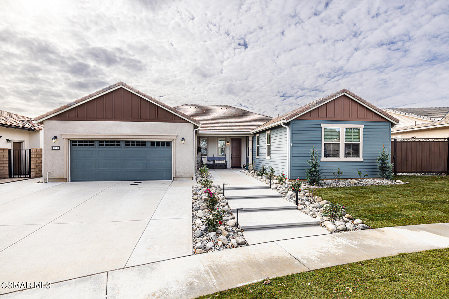 4616 Fannin Drive Simi Valley, CA 93063 - Photo 28 of 29 a front view of a house with a yard and garage