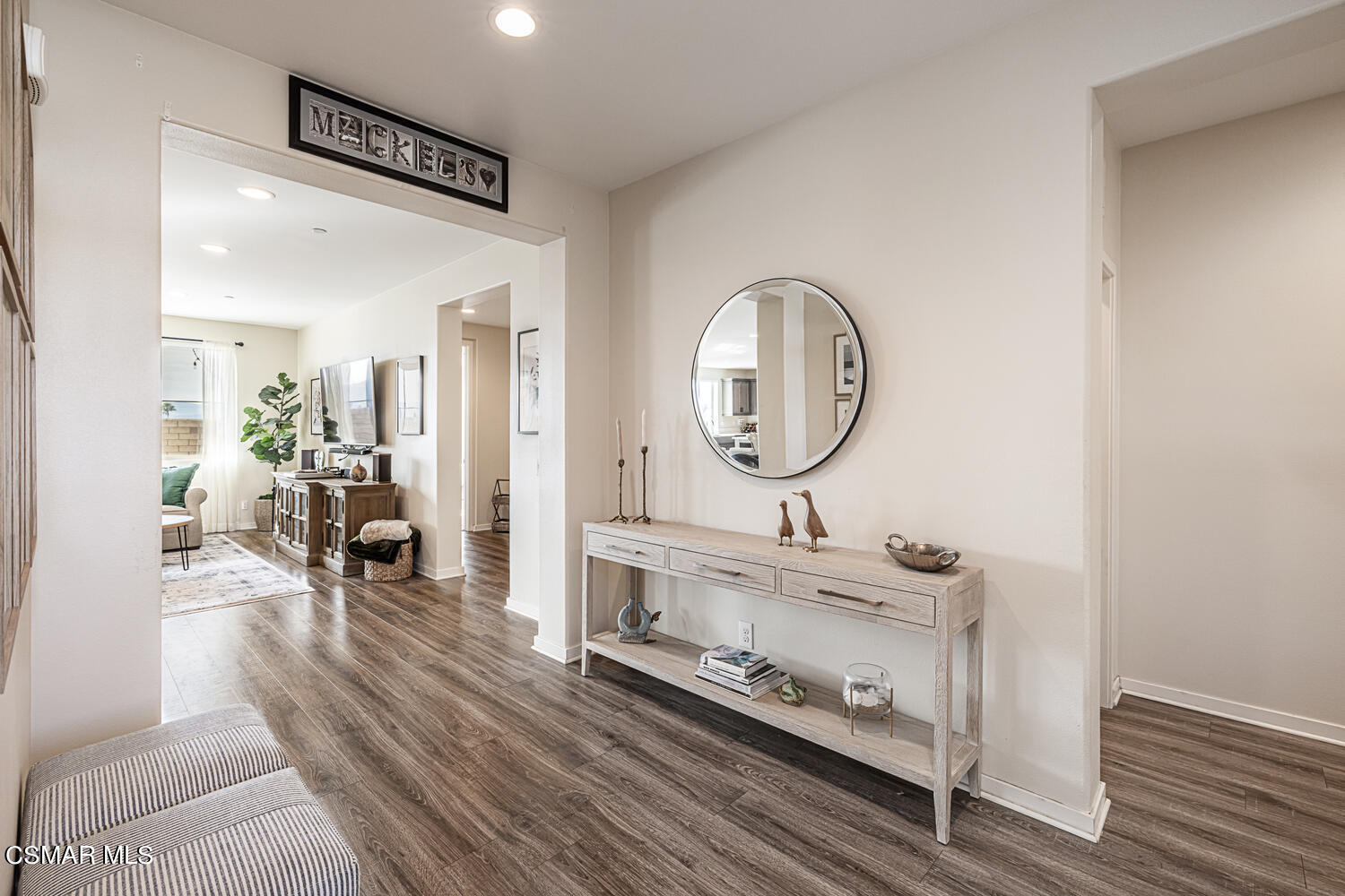 4616 Fannin Drive Simi Valley, CA 93063 - Photo 4 of 29 a room with furniture a mirror and a wooden floor