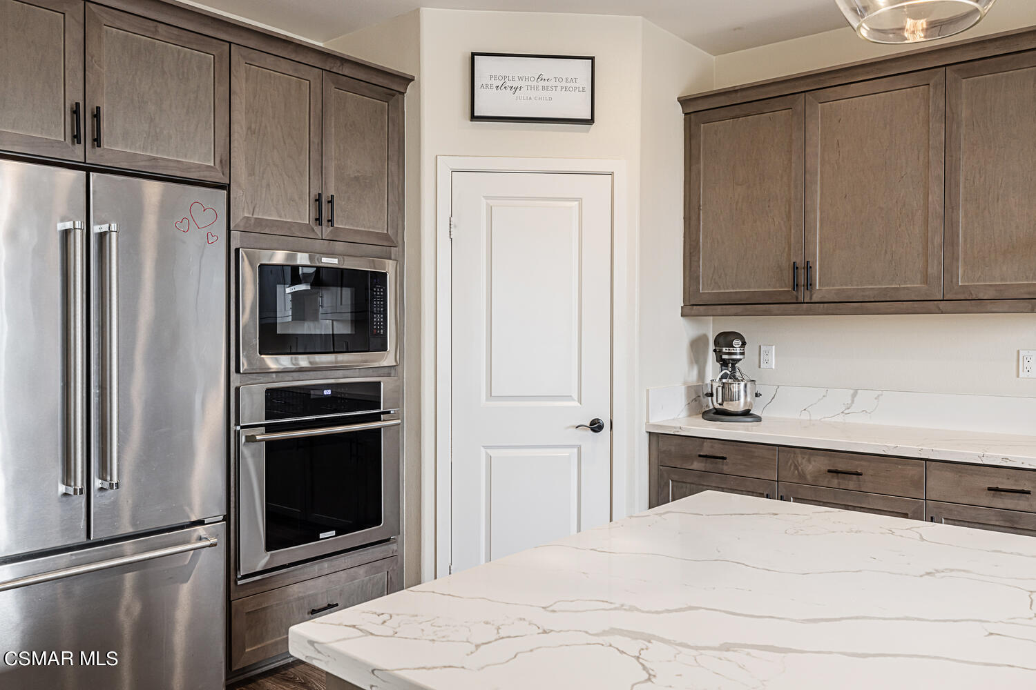 4616 Fannin Drive Simi Valley, CA 93063 - Photo 9 of 29 a kitchen with stainless steel appliances a refrigerator stove and cabinets