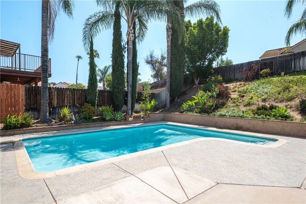 19465 Kinnow Lane Riverside, CA 92508 - Photo 41 of 61 a view of a garden with a building