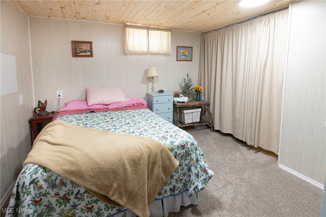 253 Sunset Road Avon Lake, OH 44012 - Photo 29 of 33 Bedroom with wood ceiling and light carpet